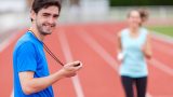 Sport coach training a young attractive woman